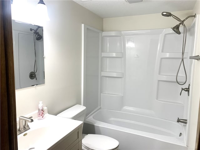 full bathroom featuring vanity, shower / tub combination, and toilet