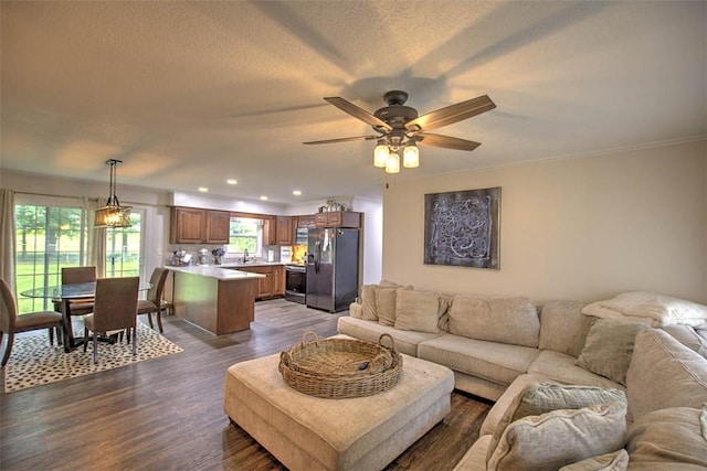 5354 N Macarthur Rd, Forsyth, IL 62535 - living area featuring dark wood-style floors, recessed lighting, ceiling fan, and crown molding