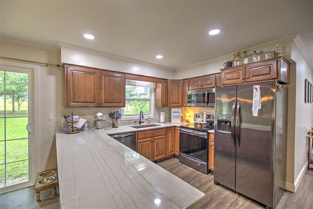 5354 N Macarthur Rd, Forsyth, IL 62535 - kitchen featuring stainless steel appliances, crown molding, dark wood finished floors, brown cabinetry, and recessed lighting