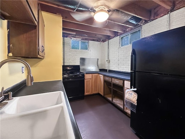 2145 E 1500 N Rd, Shelbyville, IL 62565 - kitchen with black appliances, concrete floors, a sink, and dark countertops
