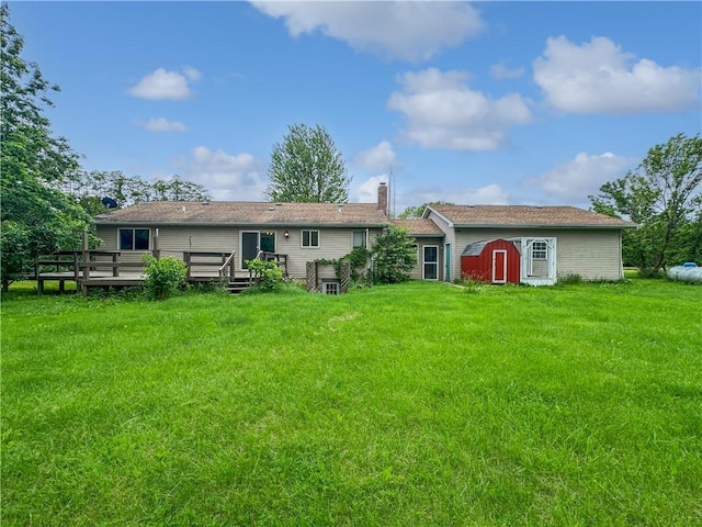 2145 E 1500 N Rd, Shelbyville, IL 62565 - rear view of house with a yard, a wooden deck, and a chimney
