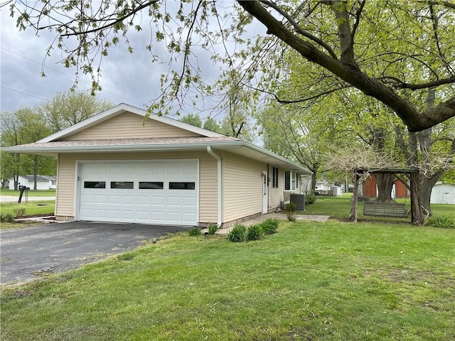 view of home's exterior with cooling unit and a yard