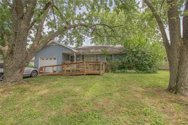 1104 N 30th St, Mattoon, IL 61938 - rear view of property featuring an attached garage, a yard, and a wooden deck