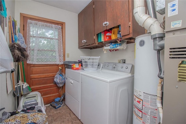 1104 N 30th St, Mattoon, IL 61938 - washroom with washer and dryer, cabinet space, gas water heater, light tile patterned flooring, and heating unit