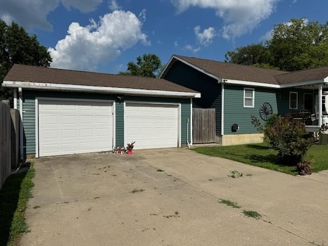 1422 Ohio Ave, Windsor, IL 61957 - ranch-style home with concrete driveway and an attached garage
