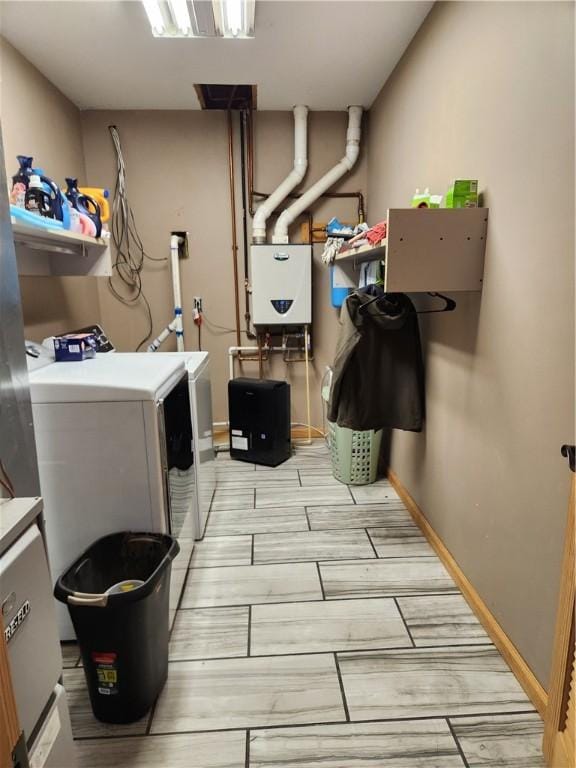 1422 Ohio Ave, Windsor, IL 61957 - laundry area with washer and dryer, wood tiled floors, and tankless water heater