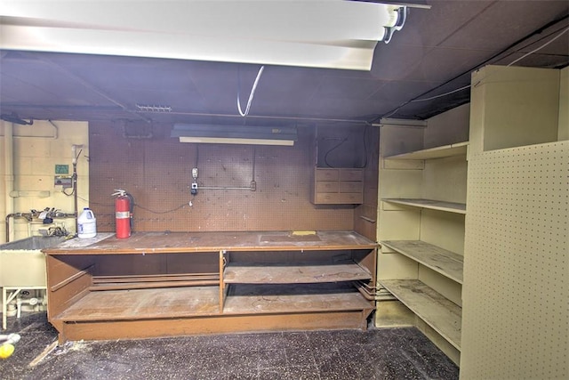 2631 Gregory Ct, Decatur, IL 62526 - unfinished basement featuring a workshop area and a sink