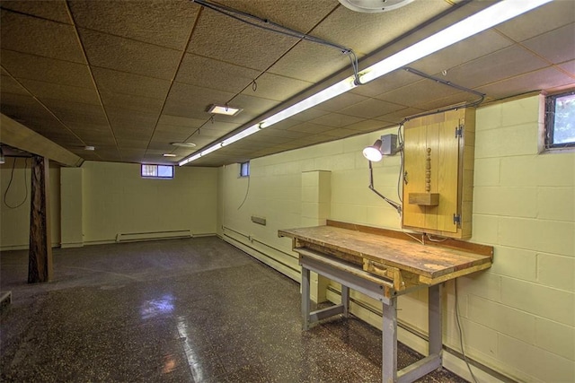 2631 Gregory Ct, Decatur, IL 62526 - below grade area with baseboard heating, concrete block wall, a baseboard heating unit, and a drop ceiling