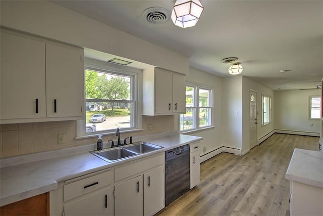 2631 Gregory Ct, Decatur, IL 62526 - kitchen featuring dishwasher, a sink, backsplash, and light wood-style flooring