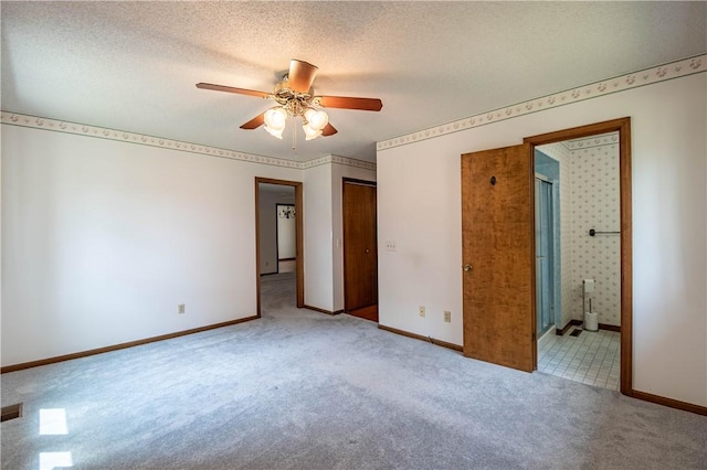 4642 Dogwood Ct, Decatur, IL 62526 - unfurnished bedroom with carpet flooring, connected bathroom, and ceiling fan