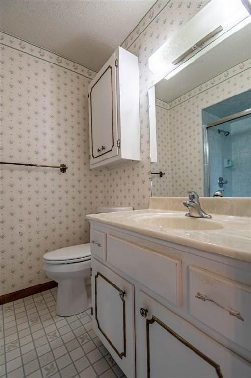 4642 Dogwood Ct, Decatur, IL 62526 - bathroom featuring wallpapered walls, vanity, and a shower with shower door