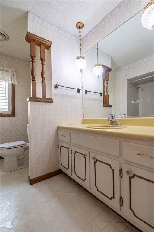 4642 Dogwood Ct, Decatur, IL 62526 - bathroom with vanity, a textured ceiling, wallpapered walls, and a chandelier