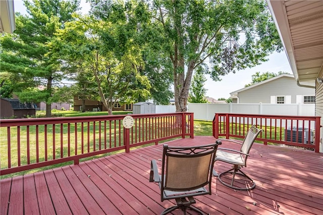 4642 Dogwood Ct, Decatur, IL 62526 - wooden terrace with a storage shed and a fenced backyard