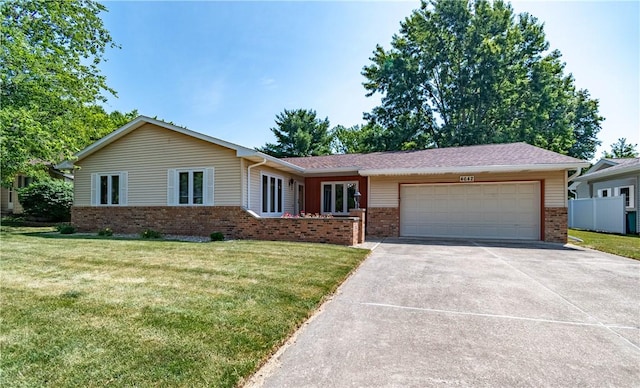 4642 Dogwood Ct, Decatur, IL 62526 - single story home with brick siding, an attached garage, driveway, and a front lawn