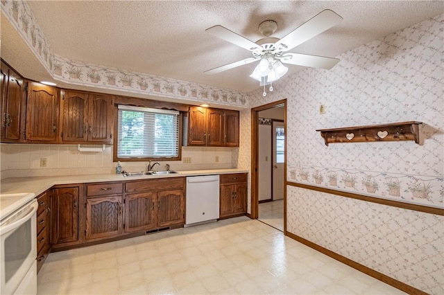 4642 Dogwood Ct, Decatur, IL 62526 - kitchen featuring white appliances, light flooring, light countertops, wallpapered walls, and a ceiling fan