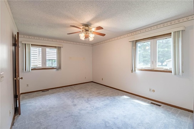 4642 Dogwood Ct, Decatur, IL 62526 - unfurnished room featuring light colored carpet, a ceiling fan, and a textured ceiling