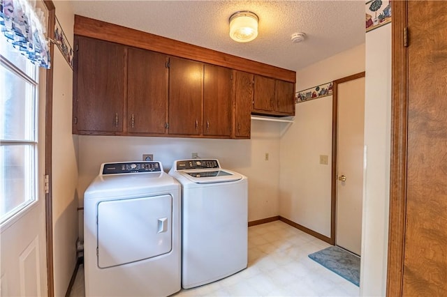 4642 Dogwood Ct, Decatur, IL 62526 - washroom featuring cabinet space, light floors, washing machine and dryer, and a textured ceiling