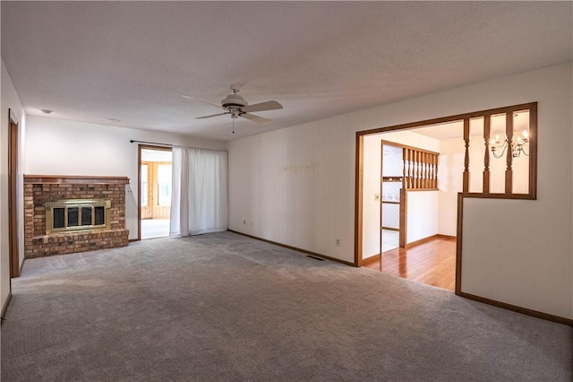 4642 Dogwood Ct, Decatur, IL 62526 - unfurnished living room featuring carpet flooring, a ceiling fan, and a brick fireplace