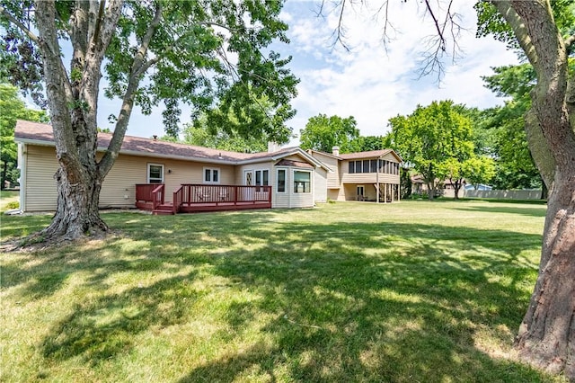 4642 Dogwood Ct, Decatur, IL 62526 - rear view of house with a yard and a wooden deck