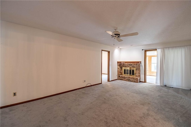 4642 Dogwood Ct, Decatur, IL 62526 - unfurnished living room featuring a ceiling fan, carpet, and a fireplace