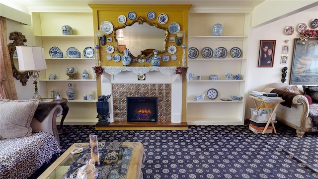 living room with built in features and a fireplace