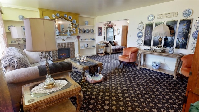 carpeted living room with a tile fireplace