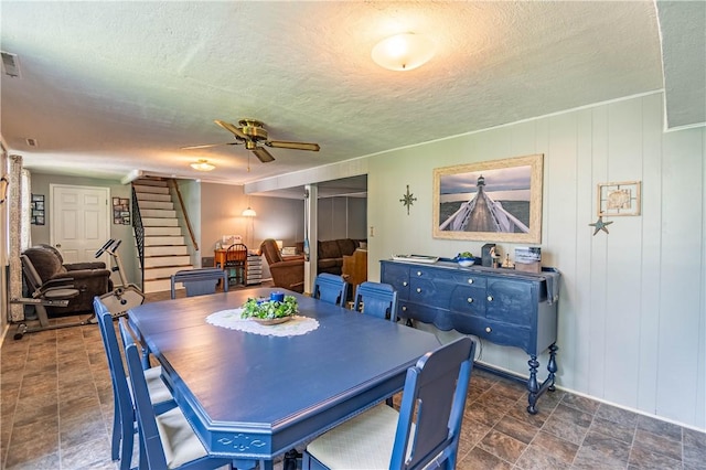 37 Ohio Dr, Decatur, IL 62526 - dining area with stairs, ceiling fan, and a textured ceiling