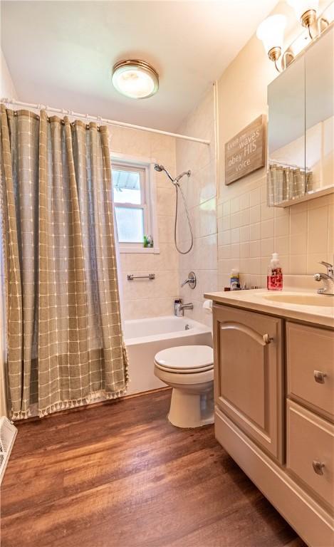 37 Ohio Dr, Decatur, IL 62526 - bathroom with vanity, shower / bath combo, and wood finished floors