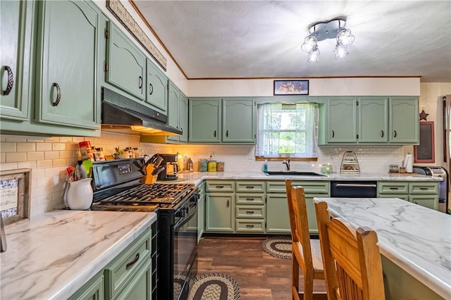 37 Ohio Dr, Decatur, IL 62526 - kitchen featuring green cabinetry, black gas stove, dark wood-style flooring, and under cabinet range hood