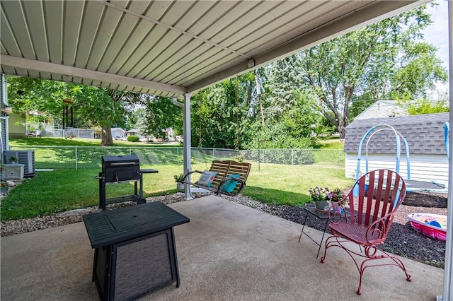37 Ohio Dr, Decatur, IL 62526 - fenced backyard with a patio, a storage shed, and a grill