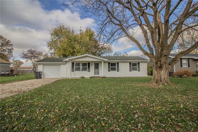 ranch-style home featuring a garage and a front yard