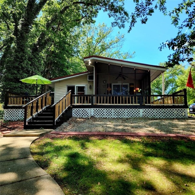 15 Oak Tree Ln, Pana, IL 62557 - back of house featuring a ceiling fan, a wooden deck, and a yard