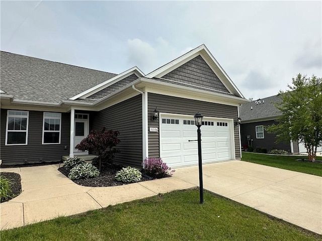 3006 E Stillwater Lndg, Urbana, IL 61802 - view of front of property with concrete driveway, a front lawn, and a garage