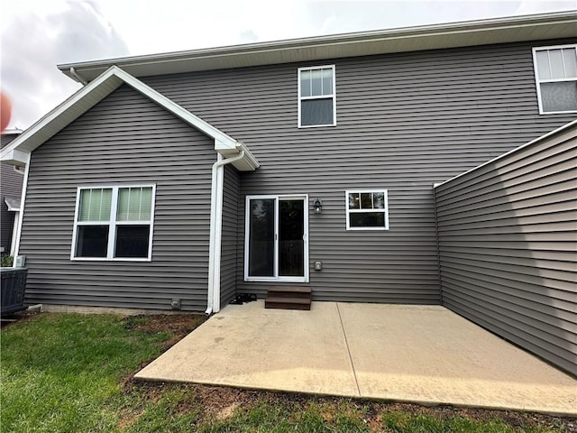 3006 E Stillwater Lndg, Urbana, IL 61802 - rear view of property featuring entry steps and a patio area