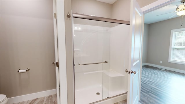 3006 E Stillwater Lndg, Urbana, IL 61802 - full bathroom featuring a shower stall, baseboards, toilet, and ceiling fan