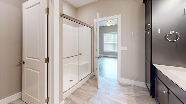 3006 E Stillwater Lndg, Urbana, IL 61802 - bathroom featuring a ceiling fan, a shower stall, baseboards, and marble finish flooring