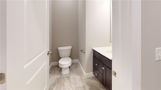 3006 E Stillwater Lndg, Urbana, IL 61802 - bathroom with toilet, vanity, and baseboards