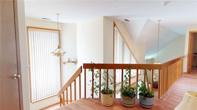 10 Lakeshore Ct, Danville, IL 61832 - hallway with an upstairs landing, carpet floors, plenty of natural light, and a chandelier