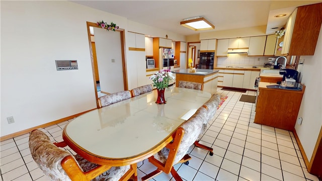 10 Lakeshore Ct, Danville, IL 61832 - dining space featuring light tile patterned floors and baseboards