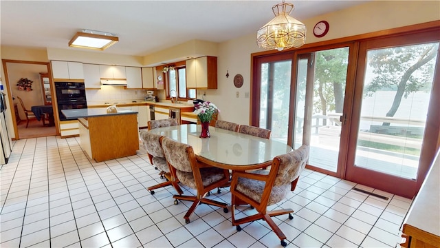 10 Lakeshore Ct, Danville, IL 61832 - dining room with healthy amount of natural light and a chandelier