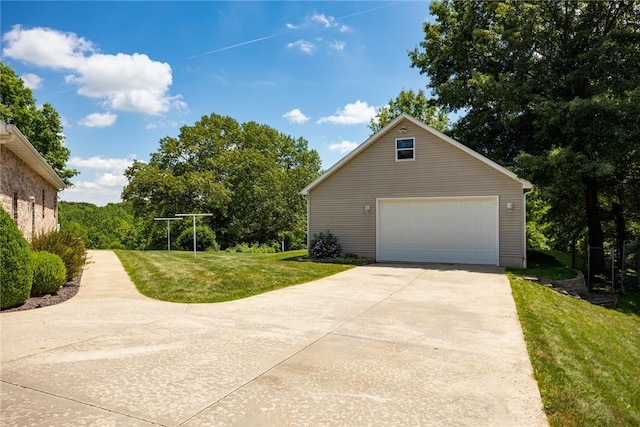 8434 Meadowview Rd, Effingham, IL 62401 - view of home's exterior featuring a detached garage and a lawn