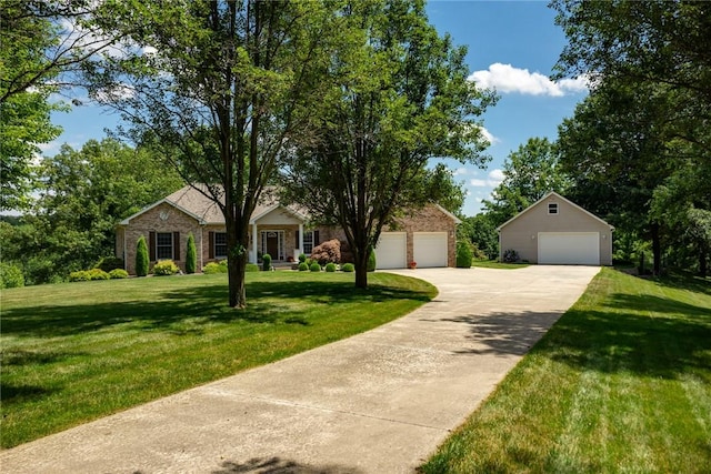 8434 Meadowview Rd, Effingham, IL 62401 - view of front of property with a detached garage, a front lawn, brick siding, and an outbuilding
