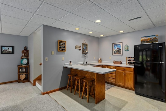 8434 Meadowview Rd, Effingham, IL 62401 - bar featuring freestanding refrigerator, a paneled ceiling, recessed lighting, and light colored carpet