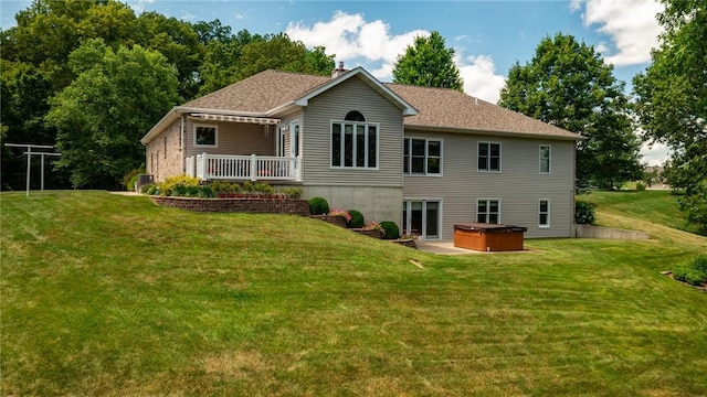 8434 Meadowview Rd, Effingham, IL 62401 - back of property with a hot tub, a yard, and a chimney