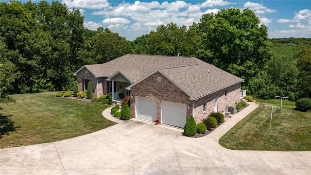 8434 Meadowview Rd, Effingham, IL 62401 - single story home featuring brick siding, concrete driveway, a front yard, a garage, and a shingled roof