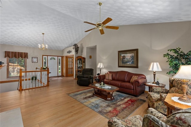 8434 Meadowview Rd, Effingham, IL 62401 - living room featuring wood finished floors, a ceiling fan, lofted ceiling, and a chandelier