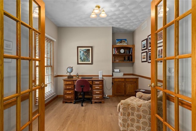8434 Meadowview Rd, Effingham, IL 62401 - office featuring french doors, light wood-style flooring, and healthy amount of natural light