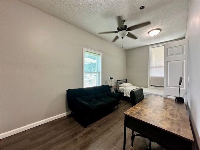 705 S 16th St, Mattoon, IL 61938 - bedroom featuring wood finished floors, a textured ceiling, and ceiling fan