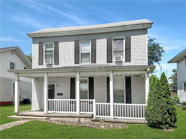 705 S 16th St, Mattoon, IL 61938 - view of front of house with a porch, cooling unit, and a front yard