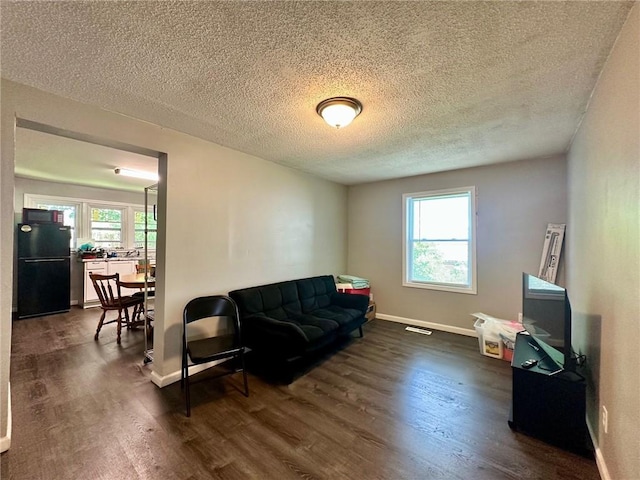 705 S 16th St, Mattoon, IL 61938 - living room featuring dark wood finished floors and a textured ceiling